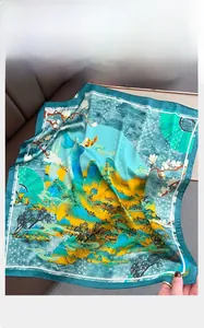 Detailed macro view of high-quality square silk scarf with traditional landscape pattern
