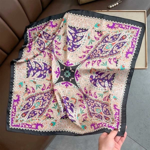 Detail showing the paisley pattern and silky texture of the vintage square neck scarf