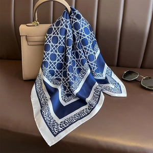 70cm geometric and leopard print satin silk square scarf on a leather handbag