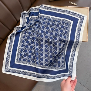 Navy blue and white silk-like square scarf with geometric and leopard print patterns