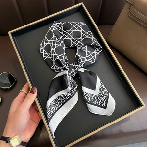 Elegant black and white silk scarf with geometric grid and leopard print patterns