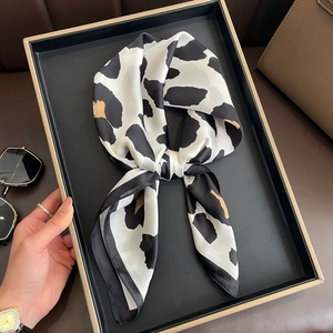 Elegant leopard print silk scarf for women displayed as a stylish necktie accessory