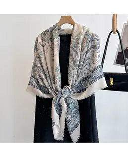 Close-up of ethnic paisley print scarf with frayed edges and elegant floral patterns