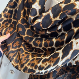 Lightweight leopard print chiffon shawl scarf with classic brown and black animal pattern