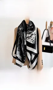 Close-up of black and white leopard pattern shawl with soft and silky texture details