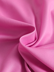 Detail of pink knitted fabric texture and soft cotton material on girls floral summer set