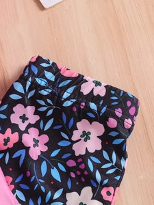 Girls' summer floral casual pants with elastic waistband and vibrant flower print detail