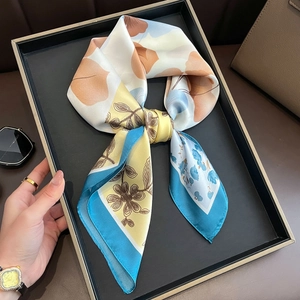 Elegant floral silk satin scarf with abstract patterns in blue and yellow tones