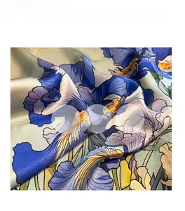 Detail of premium silk scarf showing soft drape and elegant purple iris floral print