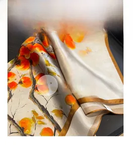 Detailed macro shot of premium silk scarf with vintage ink painting and rolled edges