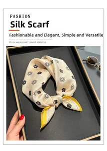 Detailed shot of camellia silk square scarf with contrasting yellow rolled edges