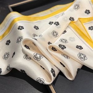 Silk camellia flower square scarf with yellow border and elegant black floral patterns