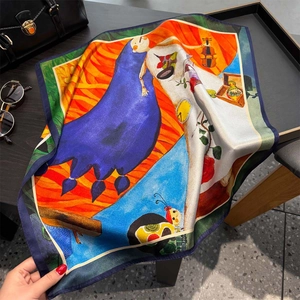 Artistic silk square scarf featuring surrealist prints and luxury fashion accessories
