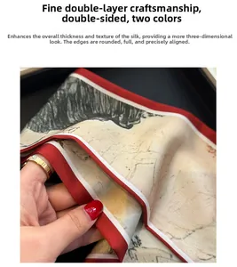 Détail d'un foulard en soie double couche avec motif peinture à l'encre et bords rouges