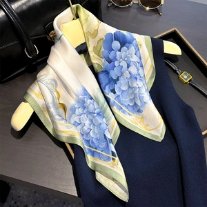 Detailed view of 100% mulberry silk square scarf with blue hydrangea floral patterns
