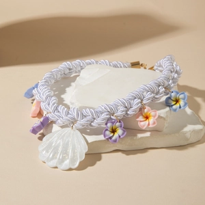 Bohemian beach choker with woven rope, colorful flowers and large seashell pendant