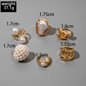 Detailed view of 6-piece gold alloy ring set with pearls and 37.1g weight specification