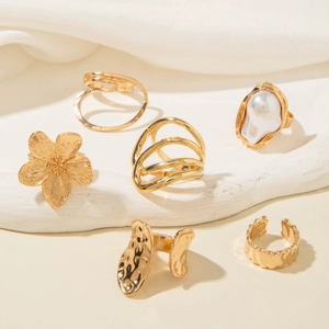 Detailed set of six gold-tone alloy rings featuring baroque pearls and floral patterns