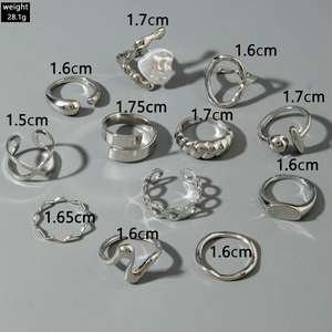 Detailed view of 11-piece silver ring set with size specs and pearl accents