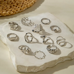 Silver alloy stackable ring set featuring baroque pearls and geometric textures on stone