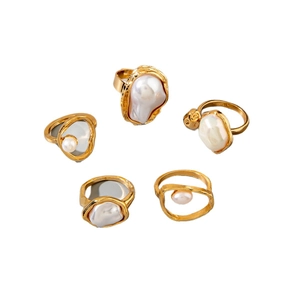 Five-piece gold ring set featuring baroque pearls and vintage floral branch designs