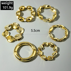 Detailed set of 6 gold plated irregular liquid metal bangles with white pearls and beads