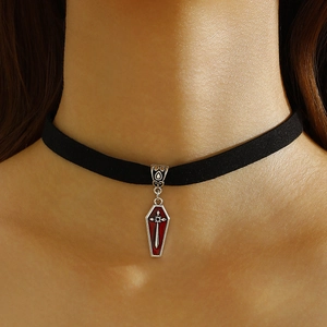 Gothic choker close-up featuring red coffin pendant with silver cross on black velvet