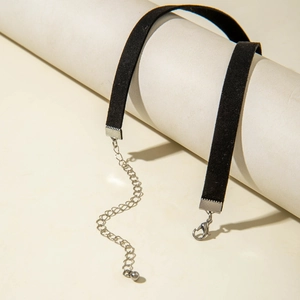 Close-up of black velvet choker with silver lobster clasp and adjustable extension chain