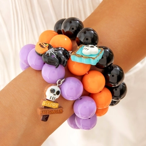 Halloween beaded bracelet set with skull, pumpkin, and spider web charms for women