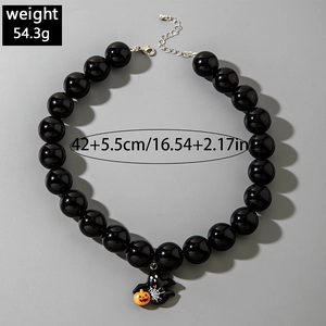 Chunky black Halloween necklace with pumpkin and spider web pendant details