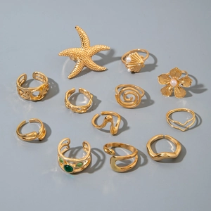12-piece gold alloy ring set with starfish, shells, flowers, and colorful gemstones
