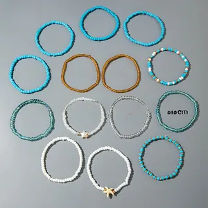 Detailed set of 13 bohemian beaded bracelets with starfish charms and summer beach motifs