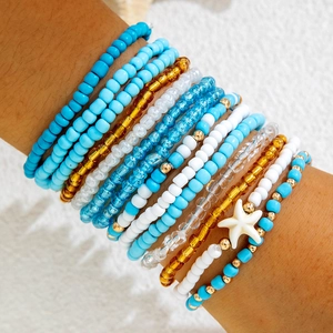 Bohemian multi-layer beaded bracelet set with blue beads and white starfish charm
