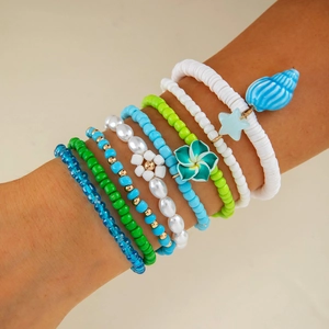 Bohemian multi-layer beaded bracelet set with faux pearls, flowers, and shell charms