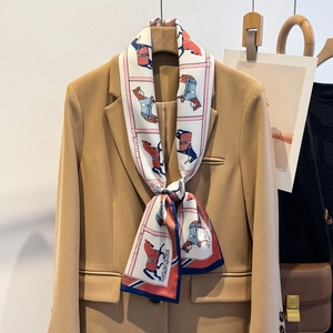 Elegant silk horse print skinny scarf paired with khaki blazer for business casual look