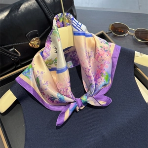 Elegant purple hydrangea print silk scarf with wide border shown on a beige hanger