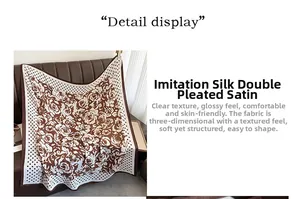 Detailed view of the soft faux silk crepe texture and floral polka dot pattern on the scarf