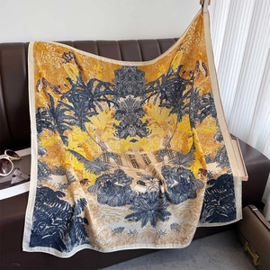 Detailed close-up of a floral silk scarf featuring leopard and tropical prints on leather