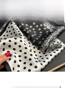 Detailed close-up showing the fine overlock stitching on polka dot silk square scarves