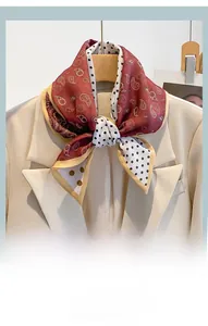 Close-up of elegant polka dot and paisley scarf paired with a beige blazer suit
