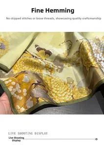 Macro shot of hand-rolled edges on a floral silk scarf with chrysanthemums and butterflies