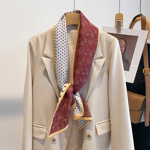 Polka dot and paisley patchwork silk scarf styled on a beige blazer for women