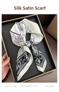 Close-up of silk-like satin square scarf with vintage black and white floral print