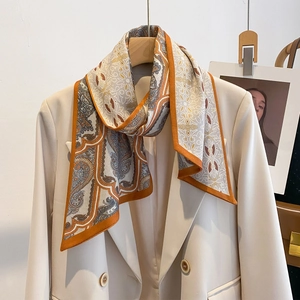 Fashionable paisley double-layer long scarf paired with a chic beige blazer for professional style