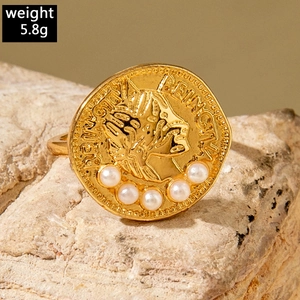 Macro detail of vintage gold coin ring with pearls and BEING engraving, weighing 5.8g