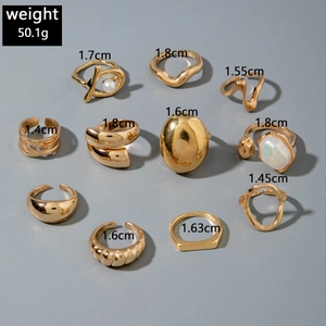 Detailed view of 11-piece gold alloy ring set with weight and size specifications
