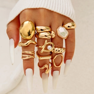Boho style gold alloy ring set with geometric hollow designs and pearl details