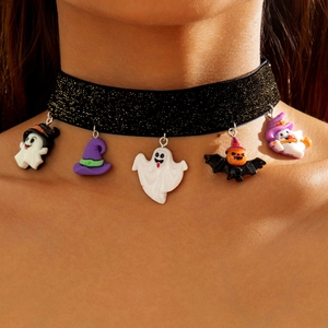 Close-up of a black glitter choker with colorful Halloween ghost and pumpkin charms