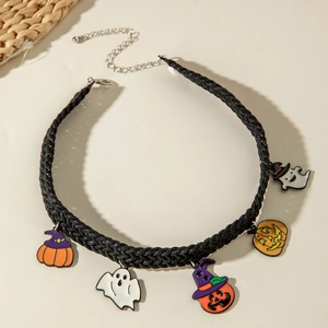 Close-up of Halloween choker with woven cord featuring pumpkin and ghost charms