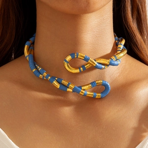 Exaggerated snake-shaped choker in gold and blue with a textured spiral wrap design
